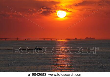 Stock Image - Sunset Over Tokyo Bay Aqua-line. Fotosearch