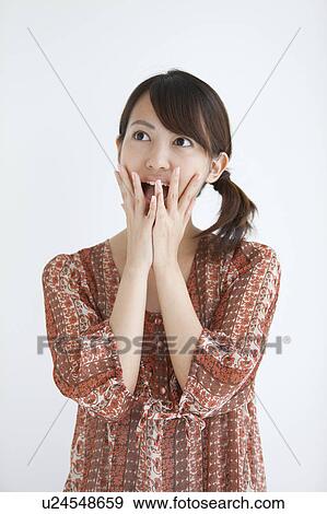 Stock Photo - Surprised Young Woman. Fotosearch