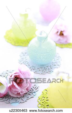 Stock Image - Texas Bluebells and Lumps on Colorful Coasters. Fotosearch