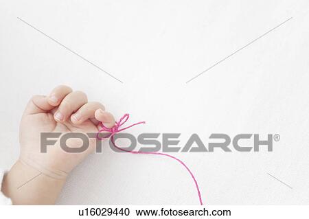 Thread Tied Around Baby's Finger View Large Photo Image Stock Image - Thread Tied Around Baby's Finger. Fotosearch