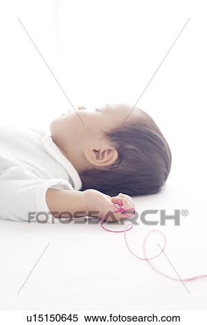 Stock Photography - Thread Tied Around Baby's Finger. Fotosearch