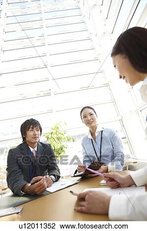 Three Businesspeople Having Meeting View Large Photo Image Stock Image - Three Businesspeople Having Meeting. Fotosearch