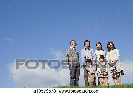 Three Generation Family Against Blue Sky View Large Photo Image Stock Image - Three Generation Family Against Blue Sky. Fotosearch