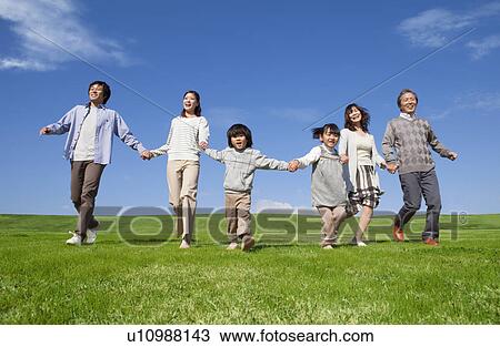 Three Generation Family Hand in Hand in Field View Large Photo Image Stock Image - Three Generation Family Hand in Hand in Field. Fotosearch