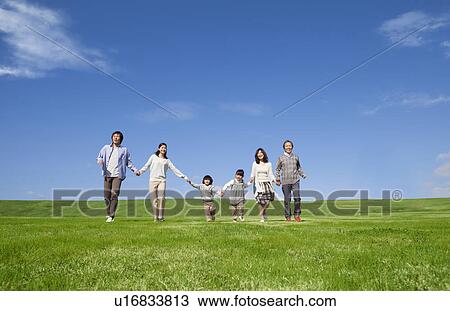 Three Generation Family Hand in Hand in Field View Large Photo Image Stock Image - Three Generation Family Hand in Hand in Field. Fotosearch