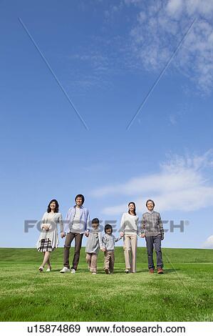 Three Generation Family Hand in Hand in Field View Large Photo Image Stock Photo - Three Generation Family Hand in Hand in Field. Fotosearch