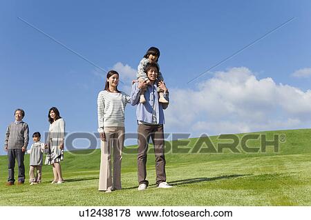 Stock Photo - Three Generation Family in Field. Fotosearch