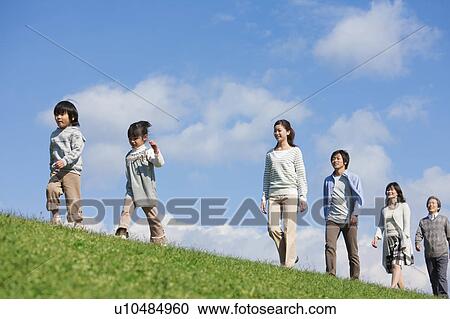 Three Generation Family Walking in Field View Large Photo Image Stock Image - Three Generation Family Walking in Field. Fotosearch