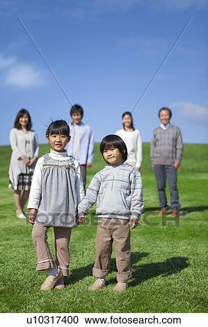 Stock Image - Three Generation Family, Young Children in Foreground. Fotosearch