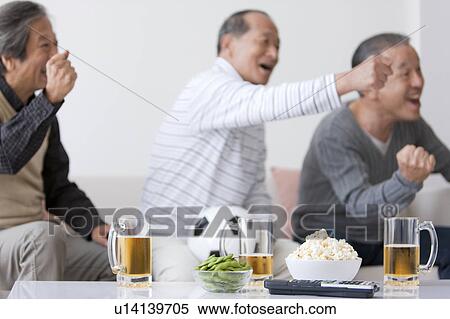 Three Senior Men Punching The Air and Watching TV View Large Photo Image Stock Photography - Three Senior Men Punching The Air and Watching TV. Fotosearch