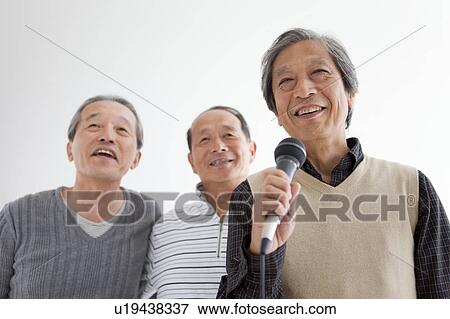 Three Senior Men Singing Karaoke View Large Photo Image Stock Photo - Three Senior Men Singing Karaoke. Fotosearch