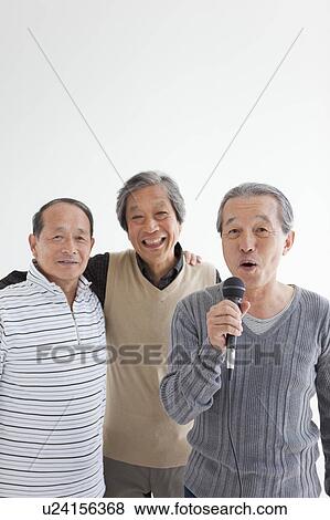 Three Senior Men Singing Karaoke View Large Photo Image Stock Photo - Three Senior Men Singing Karaoke. Fotosearch