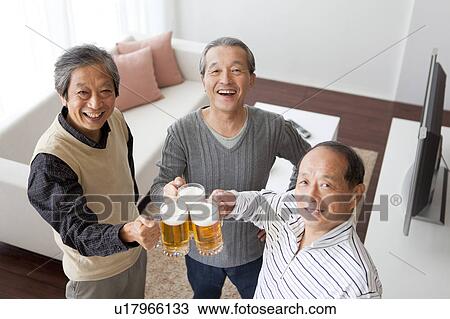 Three Senior Men Toasting with Pint View Large Photo Image Stock Image - Three Senior Men Toasting with Pint. Fotosearch