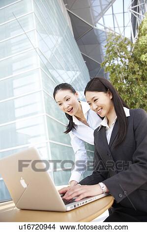 Two Businesswomen Working View Large Photo Image Picture - Two Businesswomen Working. Fotosearch