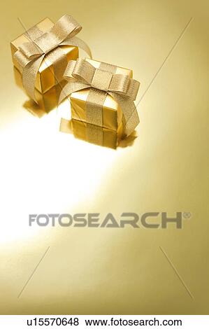 Two Golden Gift Boxes View Large Photo Image Stock Photo - Two Golden Gift Boxes. Fotosearch