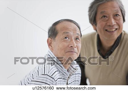 Two Senior Men Looking Up View Large Photo Image Stock Image - Two Senior Men Looking Up. Fotosearch