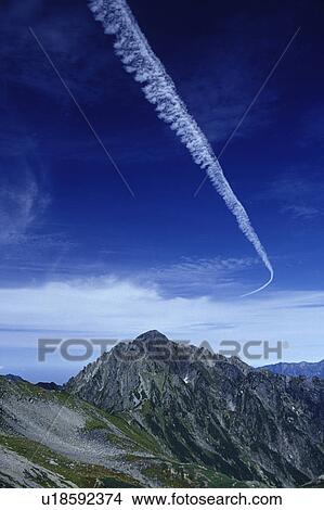 Picture - Vapor Trail Over Mt. Tsurugi-dake. Fotosearch