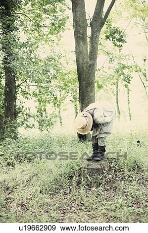 Woman bending down View Large Photo Image Stock Photo - Woman bending down. Fotosearch