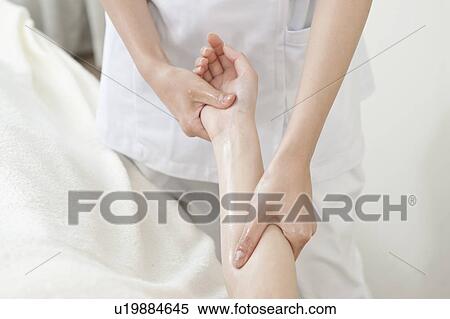 Stock Photography - Woman Receiving Hand Massage. Fotosearch