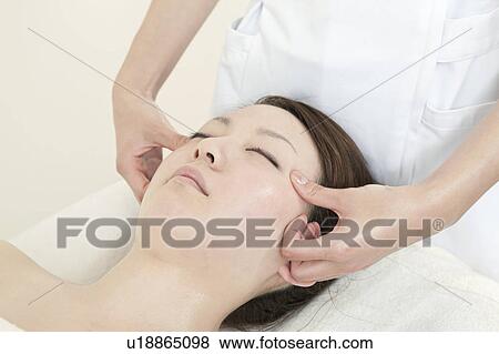 Stock Photo - Woman Receiving Head Massage. Fotosearch