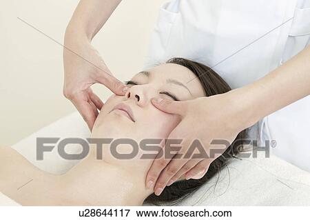 Stock Photo - Woman Receiving Head Massage. Fotosearch
