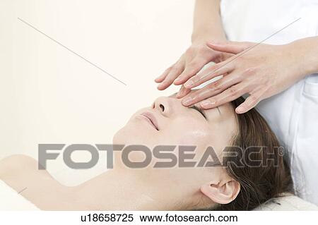 Stock Photography - Woman Receiving Head Massage. Fotosearch