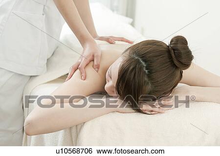 Woman Receiving Massage View Large Photo Image Stock Photograph - Woman Receiving Massage. Fotosearch