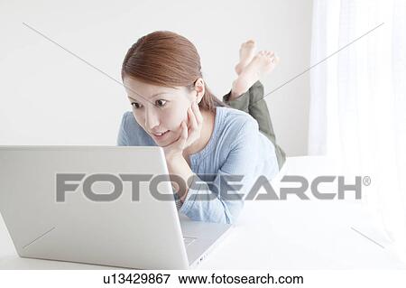 Stock Photo - Woman Using Laptop. Fotosearch
