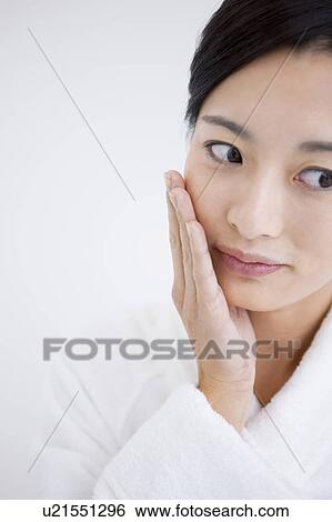 Woman with hand on chin View Large Photo Image Stock Photograph - Woman with hand on chin. Fotosearch