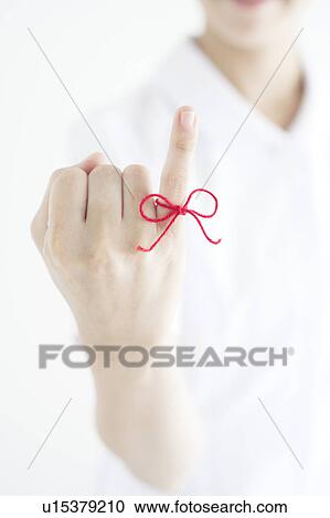 Woman with Red Thread Tied Around Her Finger View Large Photo Image Stock Image - Woman with Red Thread Tied Around Her Finger. Fotosearch