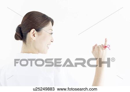 Woman with Red Thread Tied Around Her Finger View Large Photo Image Stock Image - Woman with Red Thread Tied Around Her Finger. Fotosearch