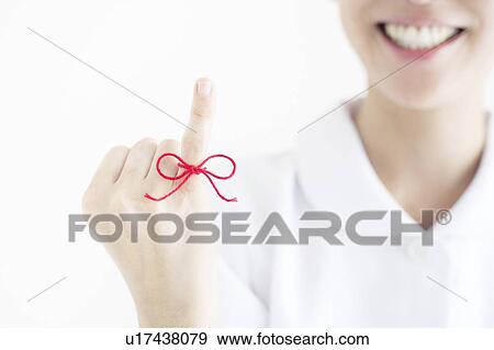 Woman with Red Thread Tied Around Her Finger View Large Photo Image Stock Photo - Woman with Red Thread Tied Around Her Finger. Fotosearch