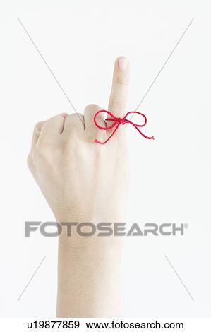 Woman with Red Thread Tied Around Her Finger View Large Photo Image Stock Photo - Woman with Red Thread Tied Around Her Finger. Fotosearch