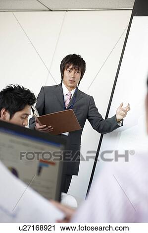 Young Businessman Giving Presentation View Large Photo Image Stock Image - Young Businessman Giving Presentation. Fotosearch