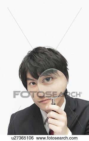 Young Businessman Looking Through Magnifying Glass View Large Photo Image Stock Photograph - Young Businessman Looking Through Magnifying Glass. Fotosearch