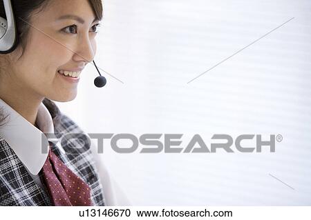 Stock Image - Young Businesswoman on Phone. Fotosearch