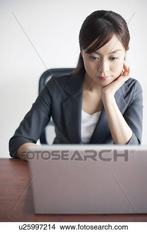 Young Businesswoman Using Laptop View Large Photo Image Picture - Young Businesswoman Using Laptop. Fotosearch