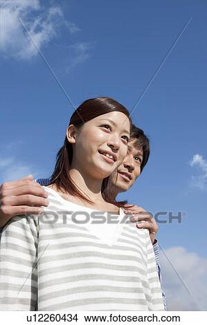Picture - Young Couple and Blue Sky. Fotosearch