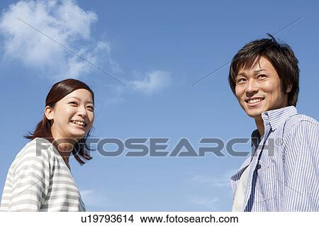 Picture - Young Couple and Blue Sky. Fotosearch