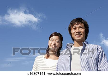 Stock Image - Young Couple and Blue Sky. Fotosearch