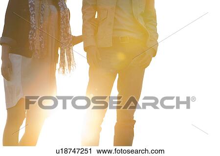 Stock Image - Young Couple at Sunset. Fotosearch