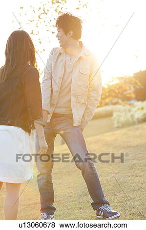 Young Couple at Sunset View Large Photo Image Stock Photo - Young Couple at Sunset. Fotosearch