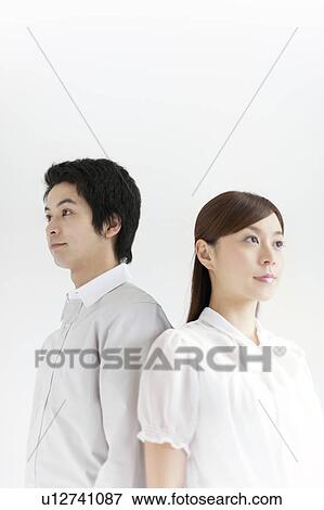 Young Couple Back to Back View Large Photo Image Stock Photo - Young Couple Back to Back. Fotosearch