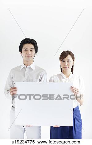 Young Couple Holding Blank Message View Large Photo Image Stock Photography - Young Couple Holding Blank Message. Fotosearch