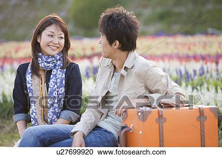 Young Couple in Field of Flowers View Large Photo Image Stock Image - Young Couple in Field of Flowers. Fotosearch