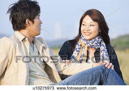 Stock Image - Young Couple Looking At Each Other. Fotosearch