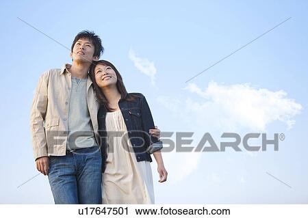 Young Couple Looking Up View Large Photo Image Stock Image - Young Couple Looking Up. Fotosearch
