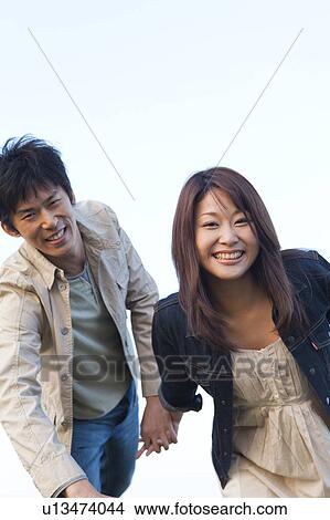 Young Couple Running View Large Photo Image Picture - Young Couple Running. Fotosearch
