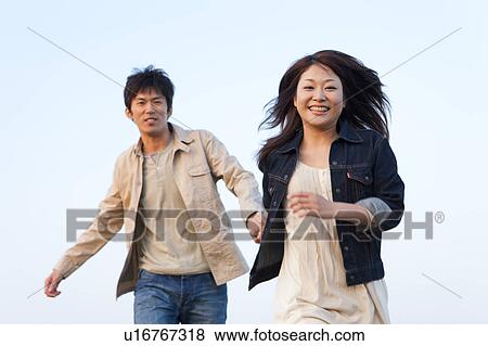 Young Couple Running View Large Photo Image Stock Photo - Young Couple Running. Fotosearch