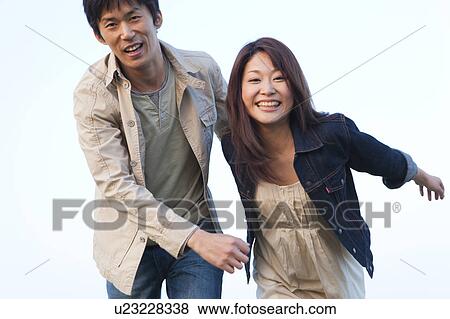 Young Couple Running View Large Photo Image Stock Photo - Young Couple Running. Fotosearch